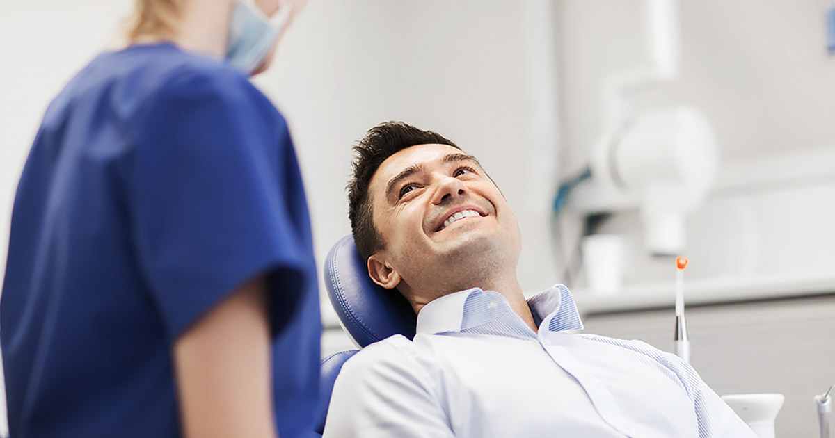 man at the dentist, but he seems happy and calm