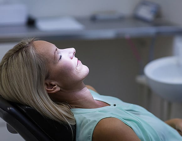 Woman at the dentist, very relaxed