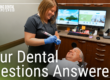 patient in chair smiling at hygenist